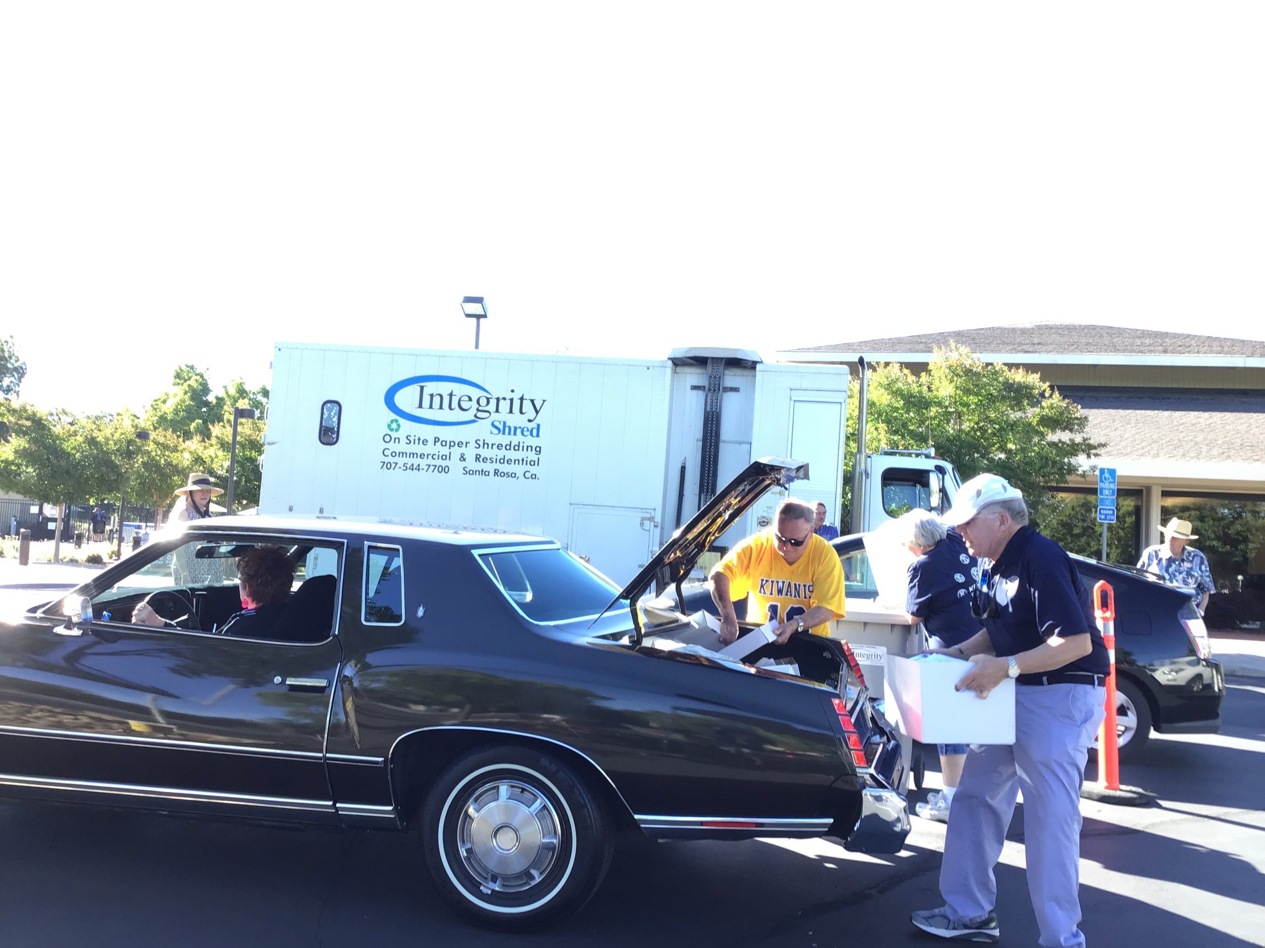 Kiwanians volunteering at bi-annual shred-a-thon.